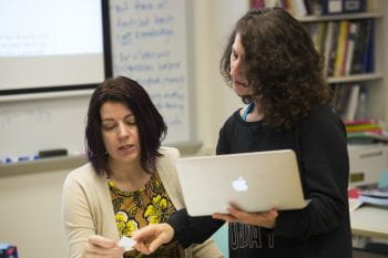 MySci’s Engineering Educator Kimberly Weaver (left) collaborates with Ferguson Florissant teacher Lisa Baker (right) on the development of a new middle school science curriculum, made possible by a $1.9 million grant from the Monsanto Fund. (Photo by Joe Angeles/WUSTL Photos)